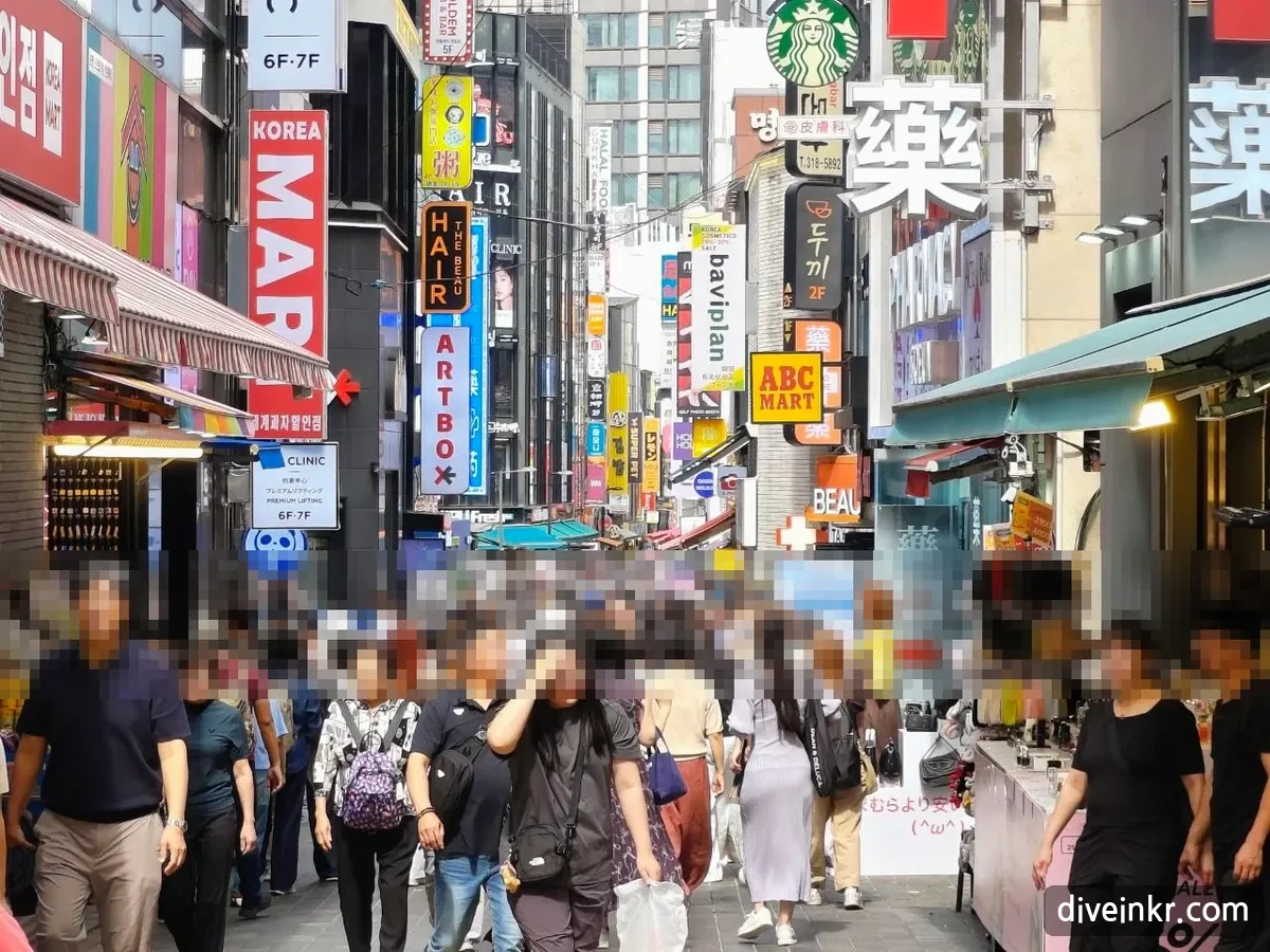 A crowded Myeongdong street lined with vertical signs, including a large white 藥 sign for a pharmacy, a TAX FREE sign with a red arrow, KOREA MART, ABC MART, a clinic on the 6th and 7th floors, and a restaurant sign reading 두끼 2F (faces blurred)